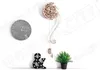 A wall decorated with a clock, a wooden pendulum clock, an ampersand sign, and a potted plant. Voir les images du produit
