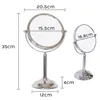Two silver makeup mirrors of different sizes are shown with dimensions indicated by measurement lines and text. Produktbild-Vorschau