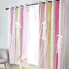 A window with curtains decorated with small white stars and bows. Náhled obrázku produktu