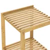 A close-up view of a wooden shelf unit, focusing on the slatted shelves and support beams. Produktbild-Vorschau