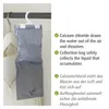 A hanging dehumidifier bag in a closet, next to clothes. Náhled obrázku produktu