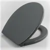 A gray toilet seat is shown on a light gray and white background. Anteprima dell’immagine prodotto