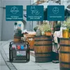 A portable generator is placed on a paved surface in front of wooden barrels and outdoor seating. Produktbild-Vorschau
