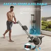 A man is shown next to a rowing machine, demonstrating its foldable feature. The background is a room with a window. Produktbild-Vorschau
