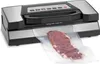 A vacuum sealer machine is shown with a piece of raw meat inside a plastic bag, partially sealed. Anteprima dell’immagine prodotto