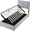 A bed frame with a lifted mattress support, revealing storage space underneath. Produktbild-Vorschau