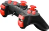 A black and red gamepad is shown from a diagonal angle against a white background. Voir les images du produit