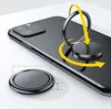 A black phone ring holder is attached to the back of a black smartphone. Yellow arrows indicate the ring's movement. Náhled obrázku produktu