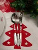 A Christmas-themed table setting with cutlery in a felt tree-shaped holder. Podgląd zdjęcia produktu