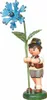 A wooden figurine of a boy holding a blue flower. Produktbild-Vorschau