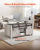 A lift-top coffee table with barn doors is shown in a living room setting. Produktbild-Vorschau
