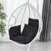 A white hanging egg chair with black cushions is shown indoors, near a window with curtains and a plant. Produktbild-Vorschau
