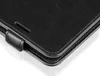 A close-up view of the corner of a black leather phone case. Produktbild-Vorschau
