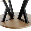A close-up, angled shot of the underside of a round wooden tabletop supported by four black metal 'X' shaped legs. The legs are secured to the tabletop with numerous small screws. Anteprima dell’immagine prodotto