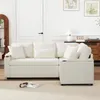 A white sectional sofa with multiple pillows is shown in a well-lit room with a white door and artwork on the wall. Produktbild-Vorschau