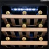 Close-up view inside a wine cooler showing multiple bottles on wooden shelves, illuminated by LED lights. Produktbild-Vorschau
