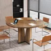 A round conference table with chairs in a modern office setting. Anteprima dell’immagine prodotto