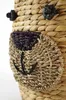 A close-up view of a woven basket with a bear face design. Produktbild-Vorschau