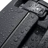 A close-up shot of a dark-colored suitcase with many water droplets on its surface. Anteprima dell’immagine prodotto