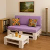 A living room scene with a pallet sofa and coffee table. Produktbild-Vorschau