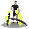 A man stands next to a black and gray adjustable workout bench with yellow arrows indicating movement or features. Náhľad obrázku produktu