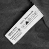 A close-up of a clothing label showing care instructions and material composition. Produktbild-Vorschau