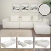 A modular white sectional sofa with cream pillows, displayed in a room with abstract art on the wall and a plush rug. Smaller inset images show different configurations of the sofa. Anteprima dell’immagine prodotto