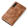 A brown flip case for a smartphone, shown from a diagonal angle on a white background. Produktbild-Vorschau