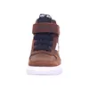 A front view of a brown high-top sneaker with white soles and black laces. Produktbild-Vorschau