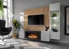 A modern living room with a wall-mounted entertainment unit featuring a TV, fireplace, and display shelves. Produktbild-Vorschau