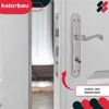 A close-up of a silver door handle and lock mechanism on a white door, with an open doorway visible in the background. Produktbild-Vorschau