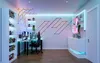 A modern gaming room setup with a desk, chair, and various LED lighting. Anteprima dell’immagine prodotto
