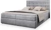 A studio shot of a gray box spring bed with a headboard and pillows. Produktbild-Vorschau