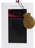 A gift set containing a black wallet and a keychain, presented in a white box with a gold tag. Náhľad obrázku produktu