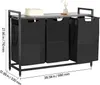 A black three-bin laundry sorter with a wooden top shelf, shown against a white background with measurement indicators. Podgląd zdjęcia produktu