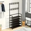 A black metal shoe rack with a coat rack attachment is shown in a room. Produktbild-Vorschau