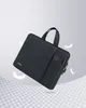 A black laptop bag is shown floating against a light gray and white background with feather-like elements. Produktbild-Vorschau