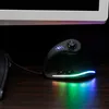 A black ergonomic gaming mouse with RGB lighting sits on a wooden desk in front of a computer monitor. Produktbild-Vorschau