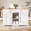 A white kitchen island with a wooden countertop is shown in a kitchen setting. Produktbild-Vorschau