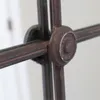 A close-up view of the decorative metalwork on a mirror frame. Produktbild-Vorschau