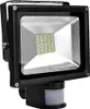 A black LED floodlight with a motion sensor attached to the bottom, shown against a white background. Produktbild-Vorschau