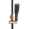 A close-up shot of a black and gold shower system with a handheld showerhead. Podgląd zdjęcia produktu