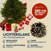 A Christmas tree with gifts and a string of lights. Produktbild-Vorschau