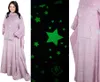 A collage of images showing a pink star-patterned blanket with sleeves, a close-up of the glow-in-the-dark stars, and a partial view of the blanket. Náhľad obrázku produktu