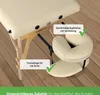 A close-up view of a massage table with accessories, highlighting features. Produktbild-Vorschau