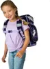 A young girl wearing a backpack. Produktbild-Vorschau