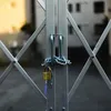 A close-up of a metal gate with a chain and padlock. Podgląd zdjęcia produktu