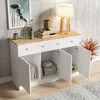 A white sideboard with a wood-effect top, featuring two drawers and three doors, is shown in a room with a textured wall and a rug. Voir les images du produit