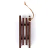 A small wooden sled ornament with a twine loop for hanging, isolated on a white background. Produktbild-Vorschau