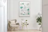 A living room scene with a framed picture on the wall, a chair, and a side table. Produktbild-Vorschau